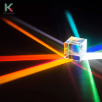 rays of different colors are being refracted through an optical cube